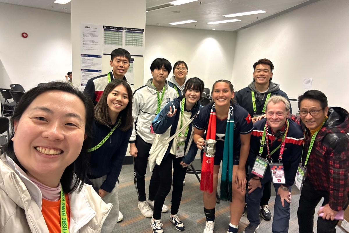 HKBU student Shanna FORREST holding Melrose Claymores Championship trophy